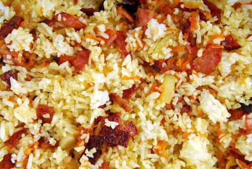 dish of rice with ham carrots and onion